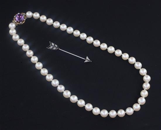 A 1920s/1930s white metal, diamond and black onyx set jabot pin modelled as an arrow, 39cm.